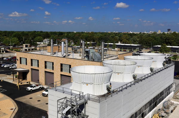 HVAC plant room — cooling-tower and chilled-water infrastructure with treatment plant in foreground