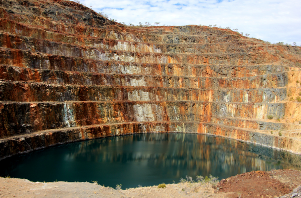 Mining site water-treatment installation — open-cut backdrop with process-water plant in foreground